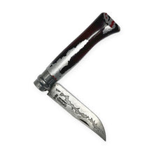 Carica l'immagine nel visualizzatore di Gallery, Coltello Opinel N°08 Carbone decorato a mano da Ugo Brigadoi, manico bordeaux e argento – semiaperto
